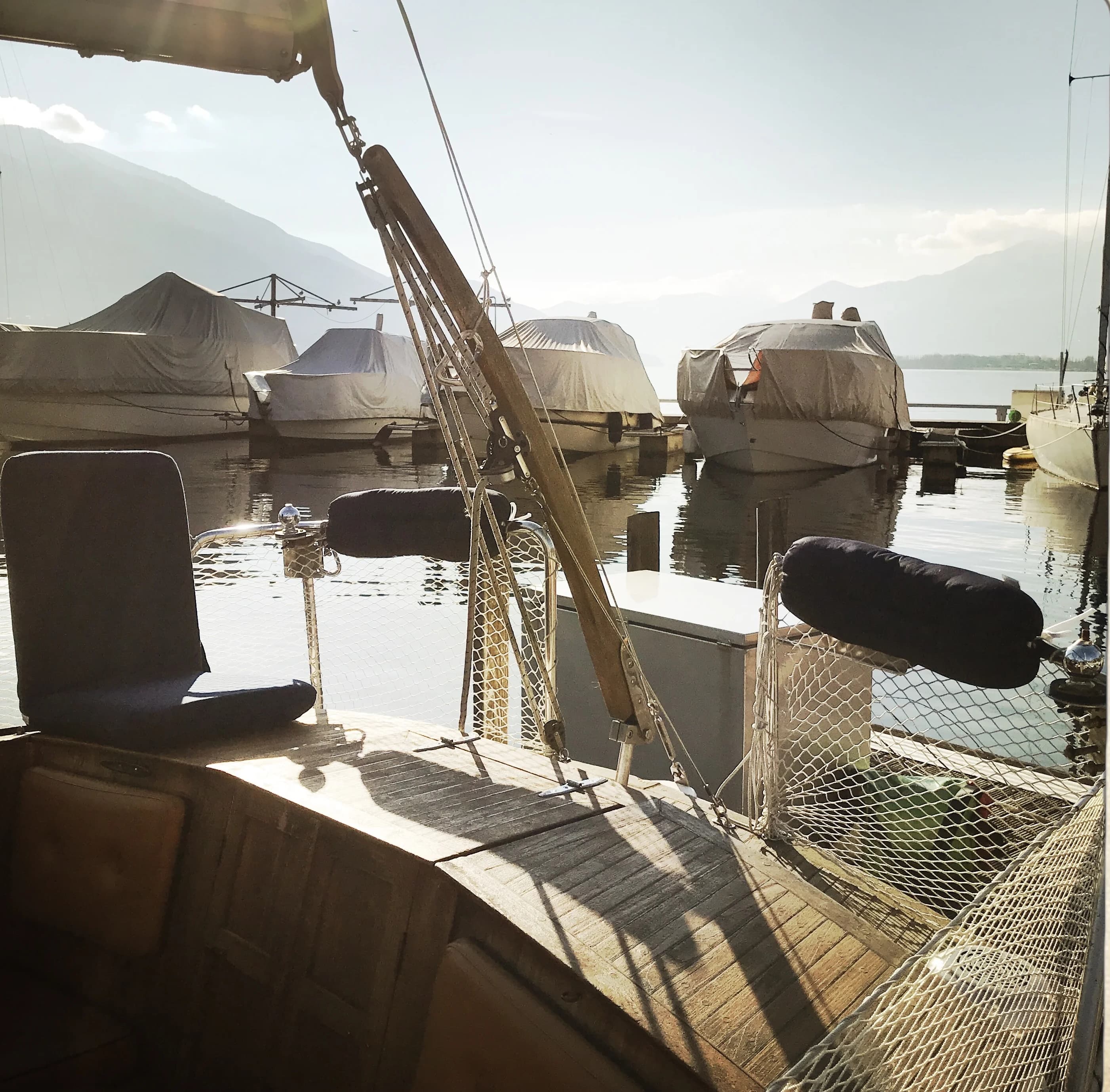 Aft deck seating in the marina sun