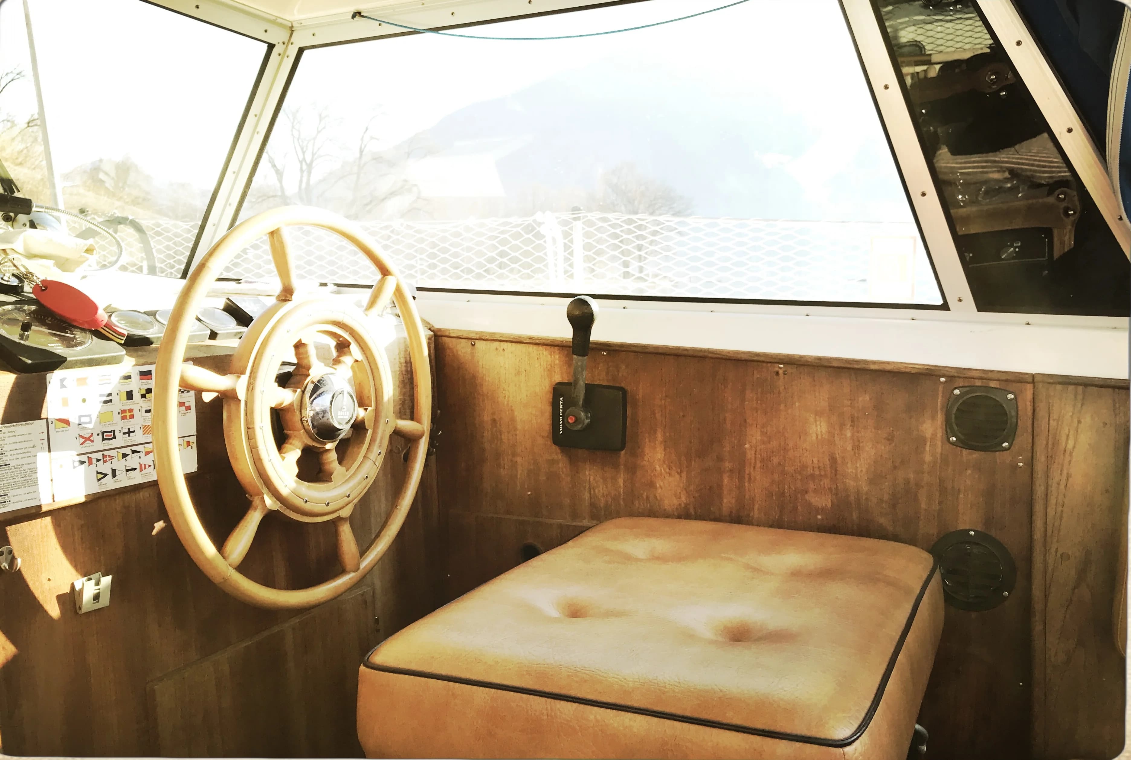 Helm station with wooden wheel and leather seat