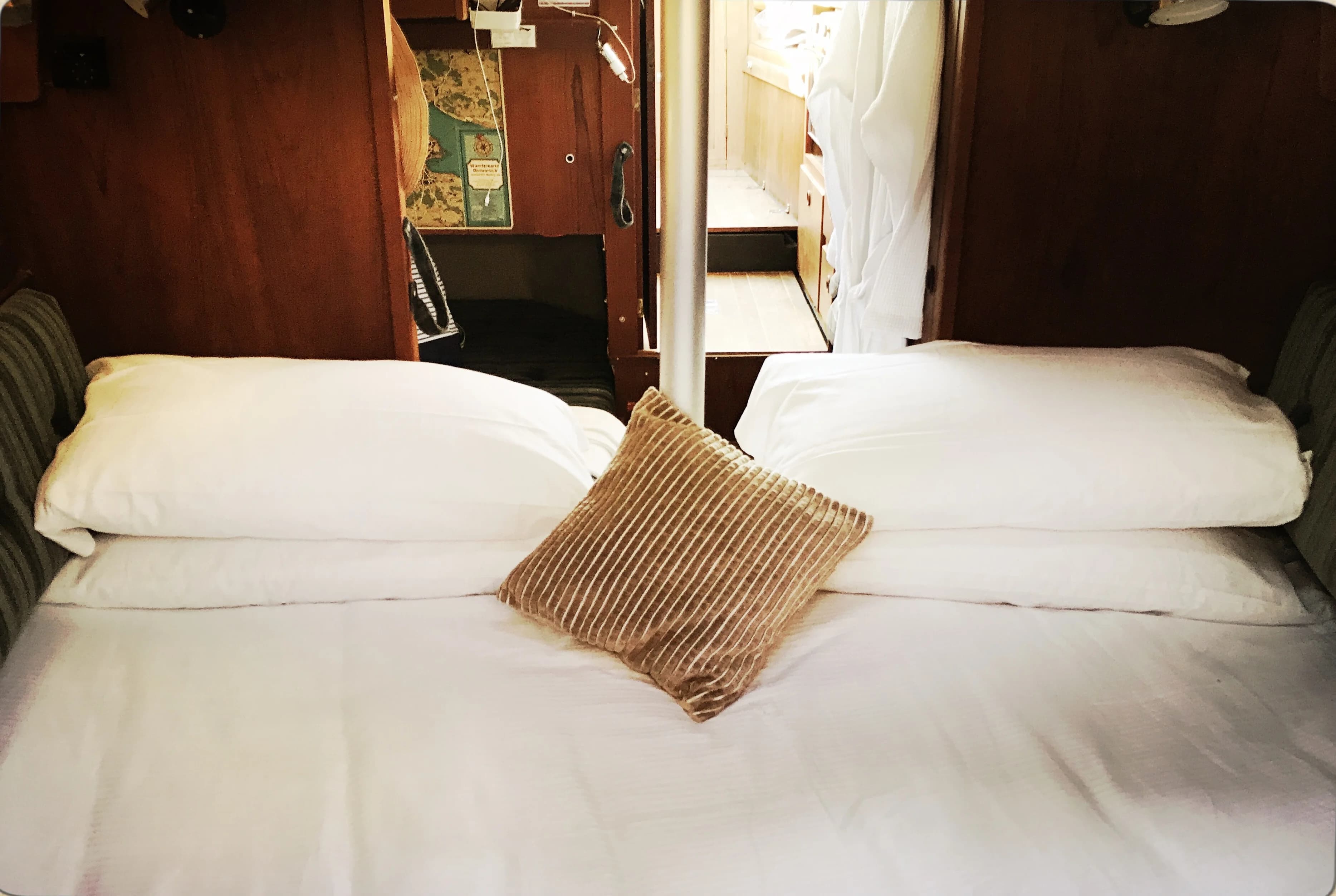 Double berth cabin with white linens