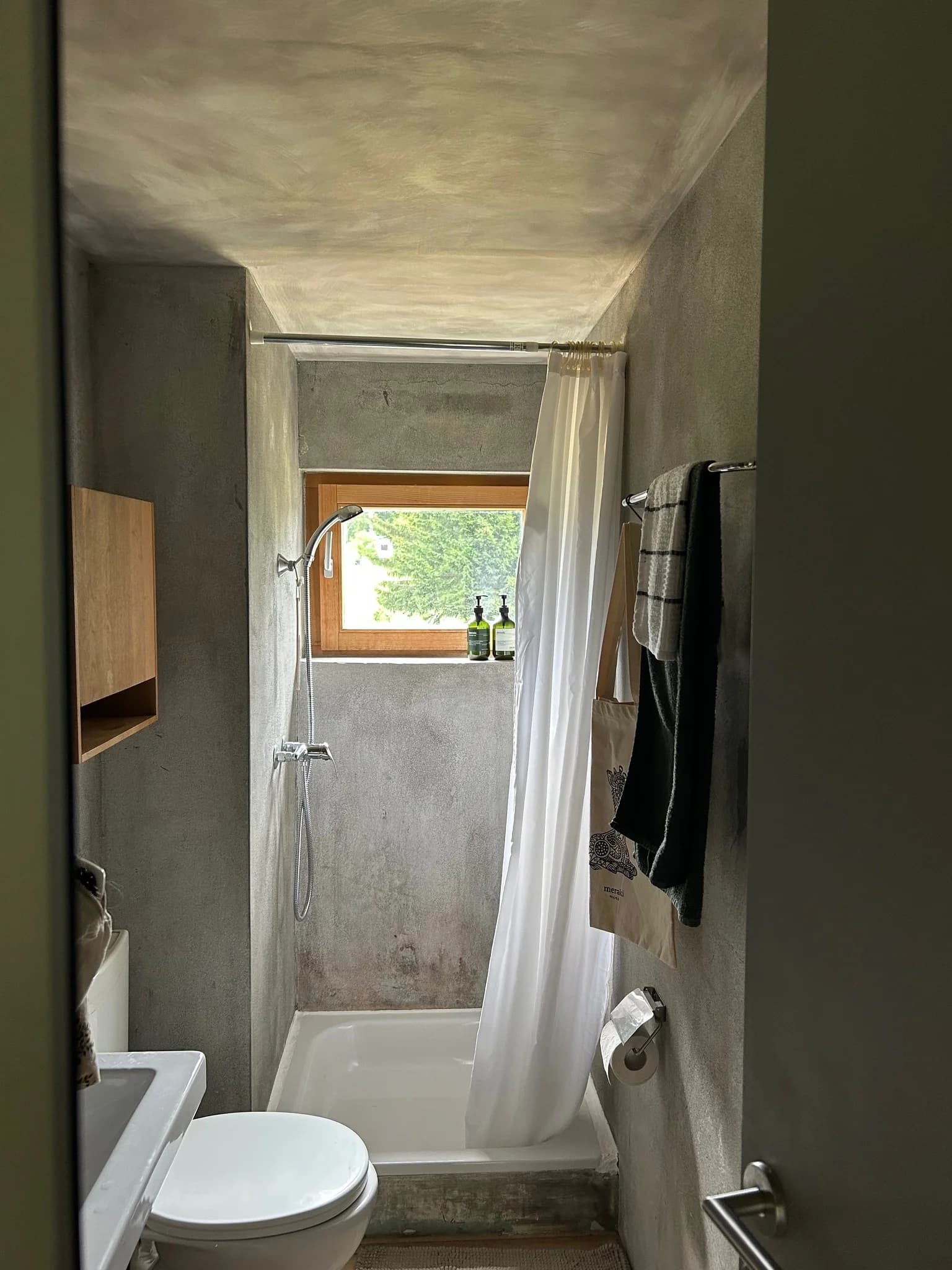 Compact bathroom shower with small window