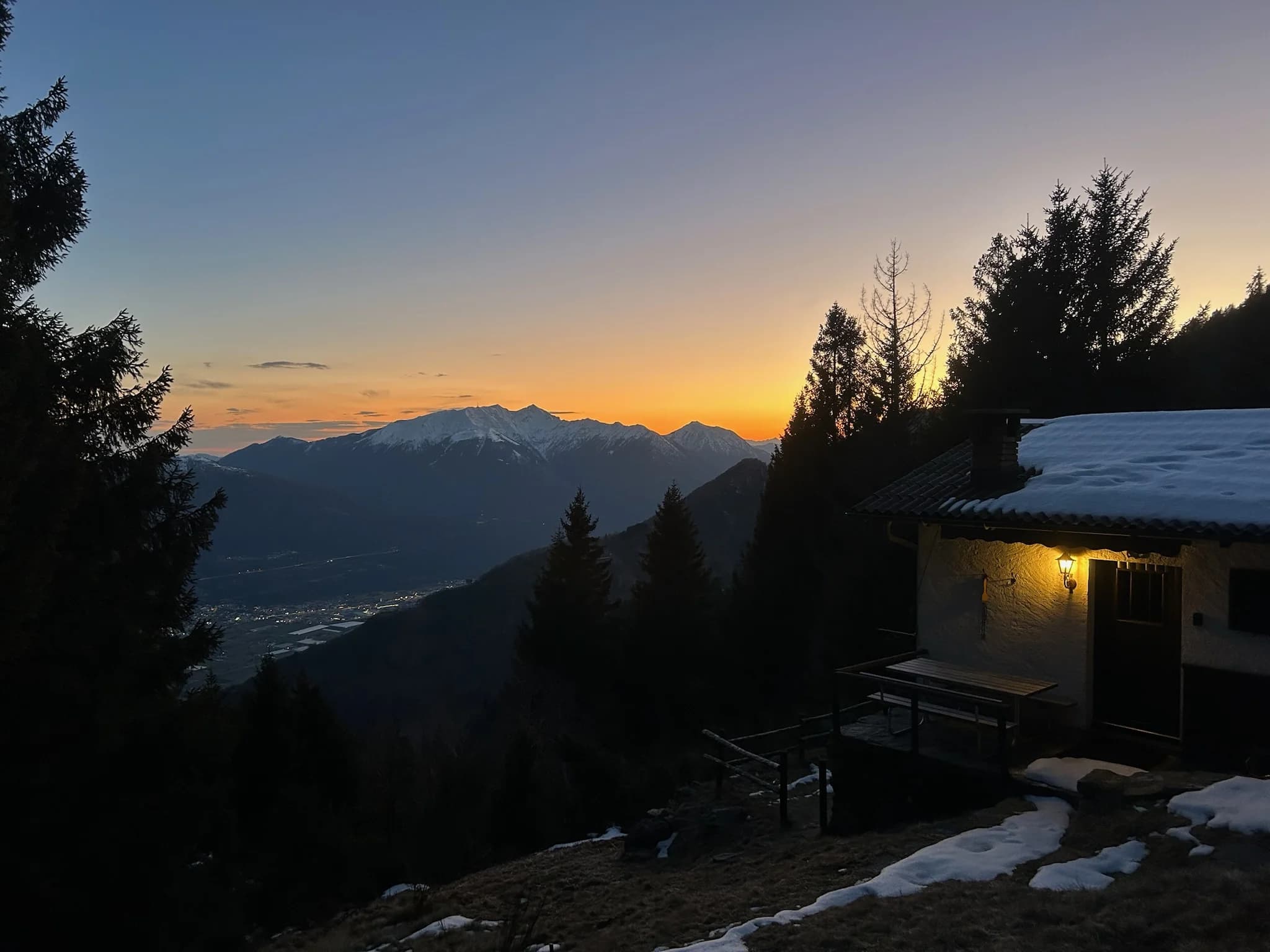 Cabin terrace at sunset over the valley