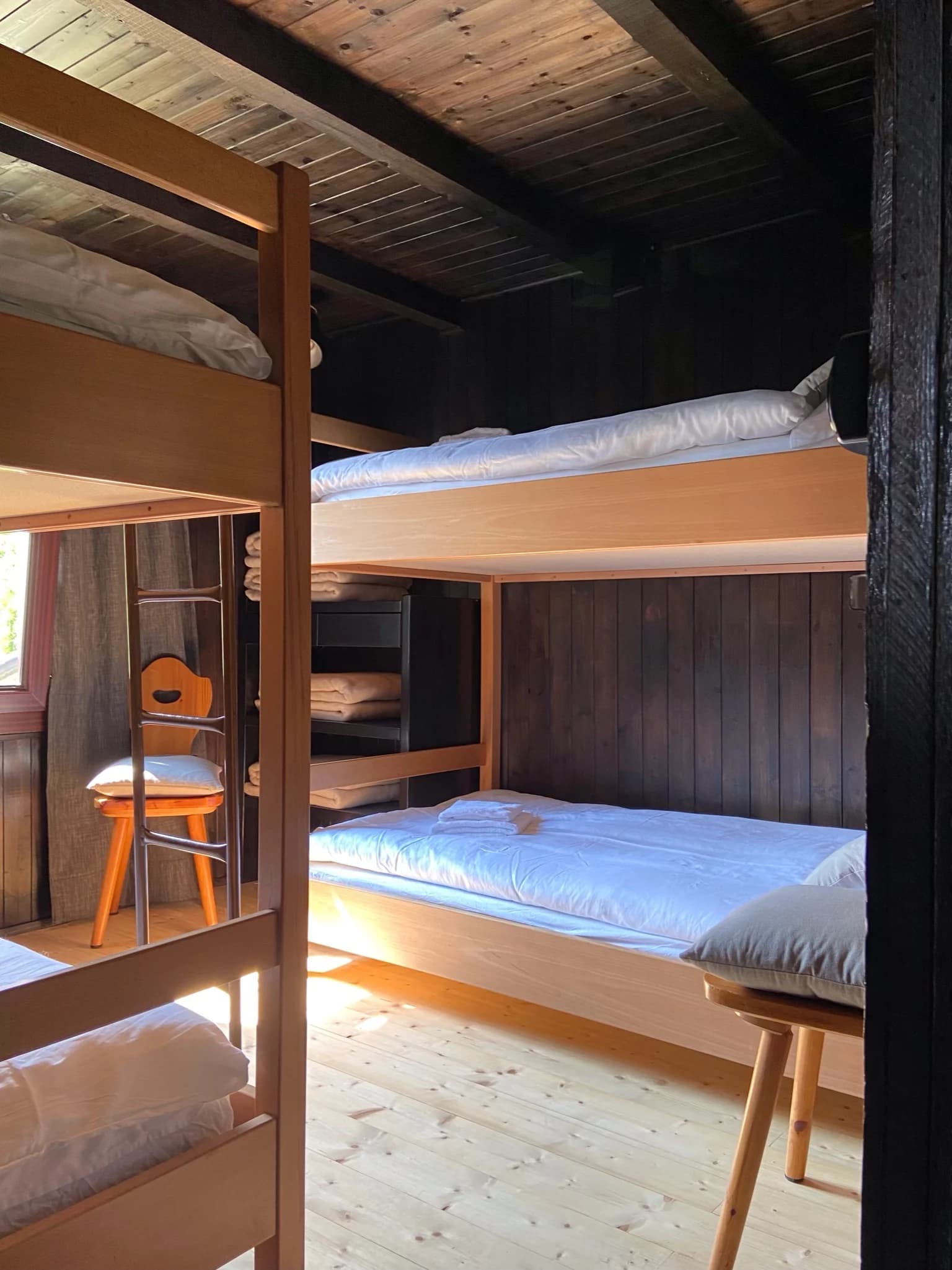 Bunk room with warm wood beds
