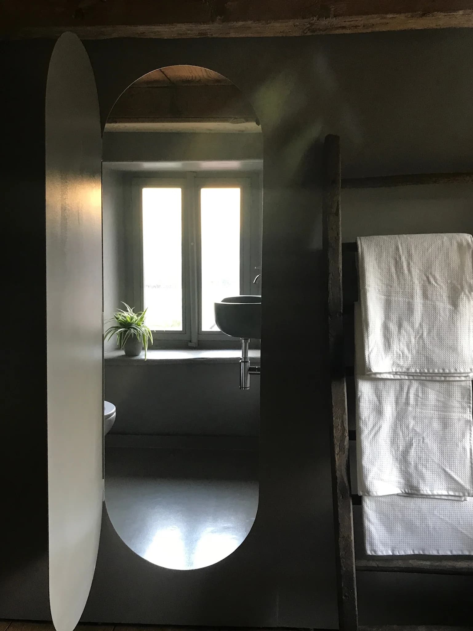 Suite bathroom mirror with window light